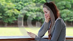 Woman looking worried after receiving text message