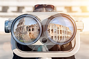 A woman looks through binoculars.