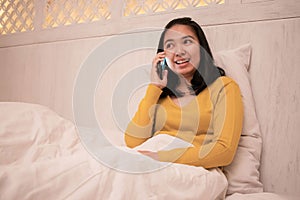A woman looks happy when calling