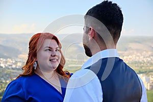 Woman looks at her bridegroom smiling