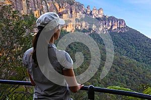 Woman looks at the landscape of The Three Sisters rock formation