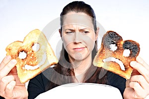 Woman looks a two different slices of toast bread