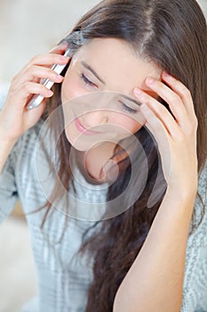 Woman looks worried during phone call