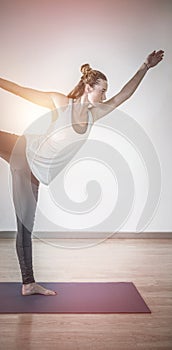 Woman in lord of dance yoga pose