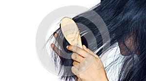 Woman losing hair as she brush on hairbrush