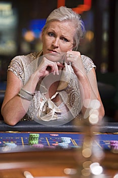 Woman losing at roulette table