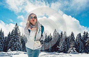 Woman loving her winter hike in the mountains