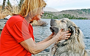 Woman lovingly holding her fury best friend