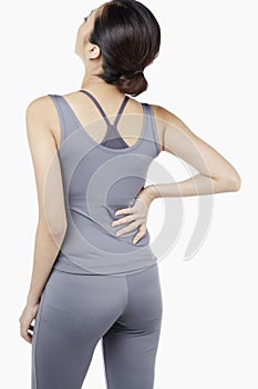 Woman with lower back pain. Conceptual image