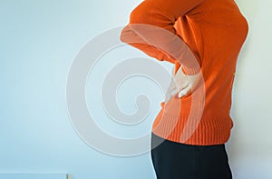 Woman with lower back pain,Female suffering from backache,Copy space on white blackground