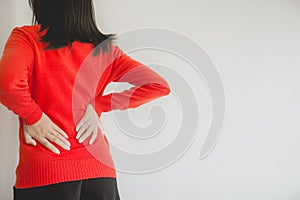 Woman with lower back pain,Female suffering from backache,Copy space and white blackground