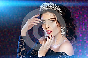 Woman in lux dress crown, queen princess lights party background