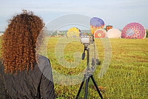 Woman with luxuriant hair shoot at camera the