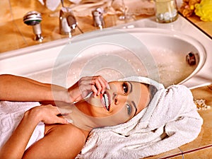 Woman luxuriate at home bath