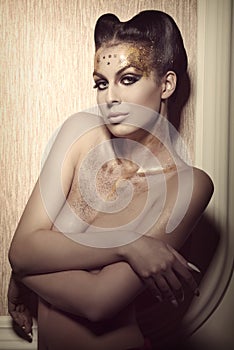 Woman with luxury golden make-up