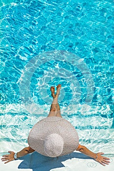 Woman in luxury spa resort near the swimming pool