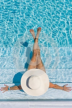 Woman in luxury spa resort near the swimming pool