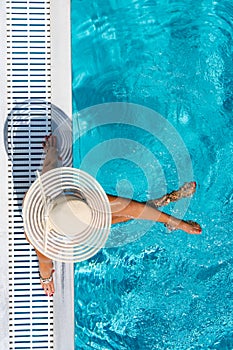 Woman in luxury spa resort near the swimming pool