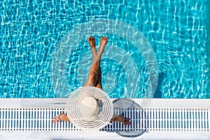 Woman in luxury spa resort near the swimming pool