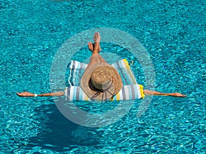 Woman in luxury spa resort near the swimming pool