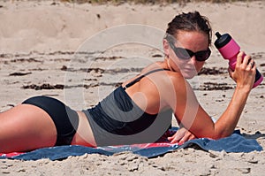 Woman Lying on Beach