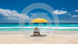 A woman lying on beach chair and umbrella on the sandy beach with blue sky background.