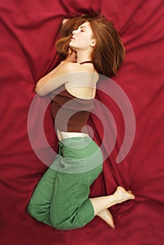 Woman lying on bed