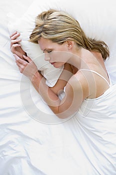 Woman lying in bed