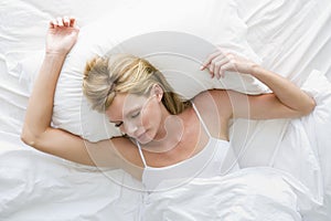 Woman lying in bed