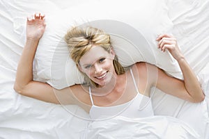 Woman lying in bed