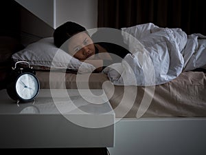 Woman lying on bed awaking, insomnia concept