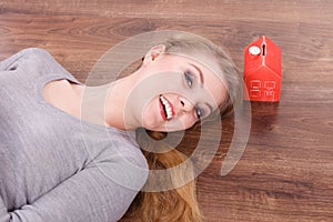 Woman lying with cash box.