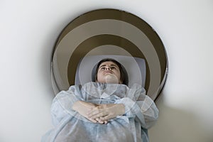 Woman Lying In CAT Scan Machine