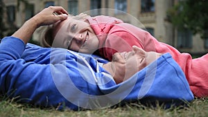 Woman lying on the chest of her beloved outdoors