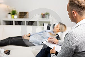 Woman lying on couch at doctors office