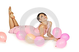 Woman lying down with air balloons