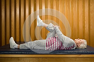 Woman lying down stretching