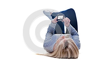 Woman lying down writing on her pda isolated