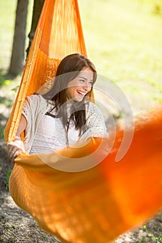 Woman lying and enjoying in hammock photo