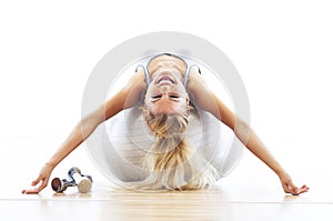 Woman lying on fitness ball