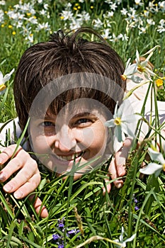 Woman lying in green grass