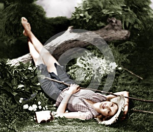 Woman lying on the ground and smiling photo