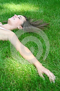 Woman lying on a lawn