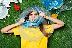 woman lying on the lawn rubbish cleaning pollution ecology