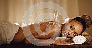 Woman Lying On Massage Table With Salt Scrub