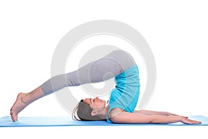 Woman lying on a mat doing yoga