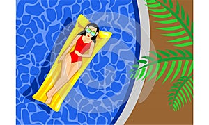 A woman lying on a mattress floating in the pool