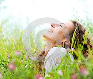 Woman lying in Meadow of Flowers