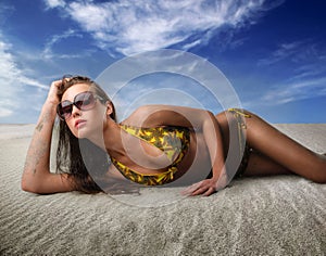 Woman lying on the sand