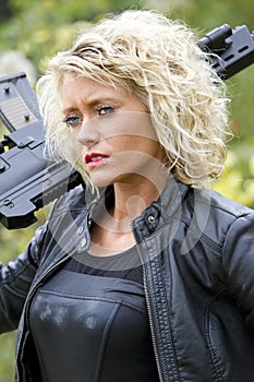 Woman with machine gun outdoor